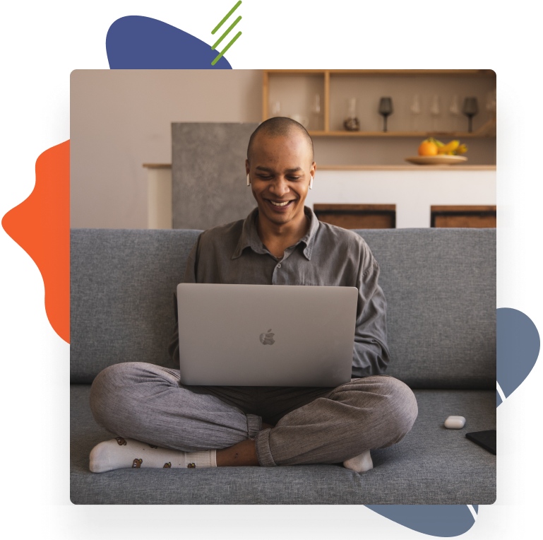 Woman sitting on a sofa while working on a laptop